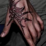 Glossy Red Dragon Tribal Tattoo On Hand