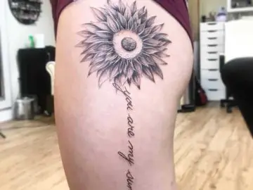 You are my sunshine lettering tattoo on the tricep